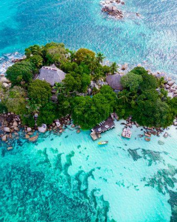 Téléchargez les photos : Drone view from above at a tropical beach in Seychelles. Anse Volbert beach Praslin with granite boulders rocks - en image libre de droit
