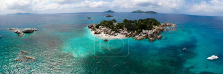 Photo for Drone view from above at a tropical beach in the Seychelles Cocos Island. - Royalty Free Image