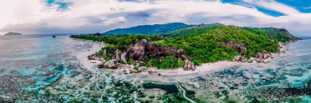 Photo for Drone view from above at a tropical white beach in the Seychelles, Anse Source dArgent white tropical beach with huge granite boulders at La Digue Island - Royalty Free Image