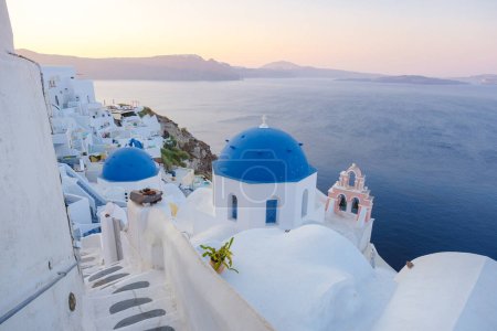Photo for Sunrise by the ocean of Oia Santorini Greece, a traditional Greek village in Santorini. - Royalty Free Image