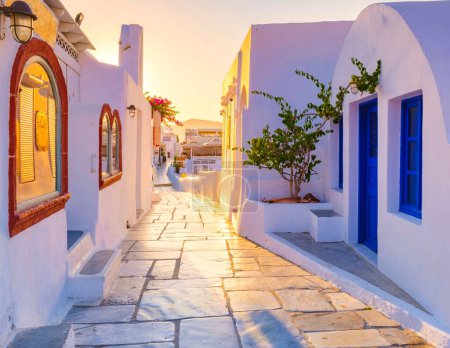 Photo for Sunrise by the ocean of Oia Santorini Greece, a traditional Greek village in Santorini. - Royalty Free Image