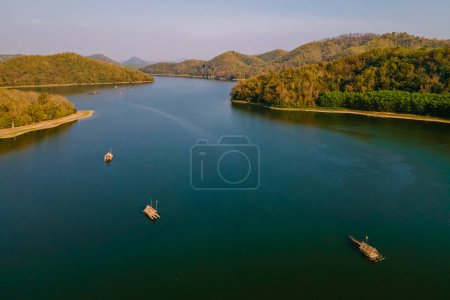 Photo for Drone view at Huai Krathing lake in the North Eastern Thailand Isaan region, famous for its floating bamboo rafts where you can have lunch or dinner in the middle of the lake. - Royalty Free Image