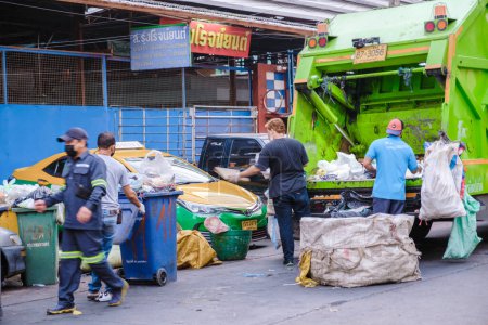 Photo for Bangkok Ratchawat Thailand March 2023 garbage collector at the streets of Bangkok inthe evening. - Royalty Free Image
