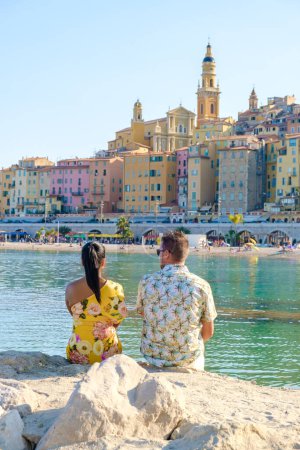 Photo for Menton France, couple men and woman on vacation at the Cote d Azur France, View on the old part of Menton, Provence-Alpes-Cote dAzur, France Europe during summer - Royalty Free Image