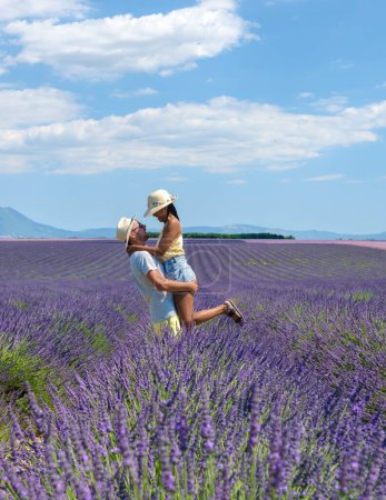 Photo for Provence, Lavender field France, Valensole Plateau, a colorful field of Lavender Valensole Plateau, Provence, Southern France Couple men and women on vacation at the Provence - Royalty Free Image