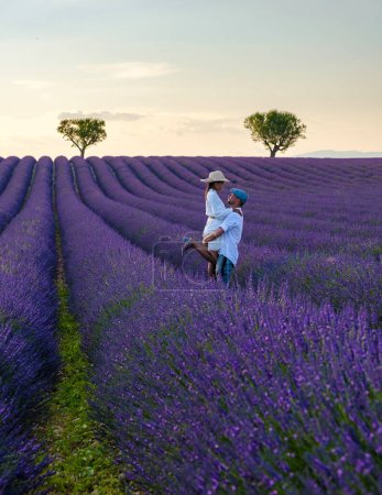 Photo for Provence, Lavender field France, Valensole Plateau, a colorful field of Lavender Valensole Plateau, Provence, Southern France Couple men and women on vacation - Royalty Free Image