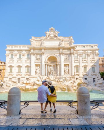 Photo for Men and women tourists at the Trevi Fountain, Rome, Italy. City trip Rome couple on a city trip in Rome. - Royalty Free Image