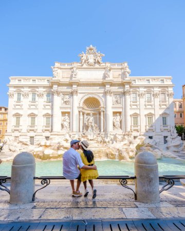 Photo for Men and women tourists at the Trevi Fountain, Rome, Italy. City trip Rome couple on a city trip in Rome during summer vacation - Royalty Free Image