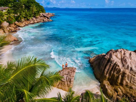 Photo for Anse Patates beach, La Digue Island, Seychelles, Drone aerial view of La Digue Seychelles bird eye view. of tropical Island. a mature couple men and women on vacation in Seychelles - Royalty Free Image