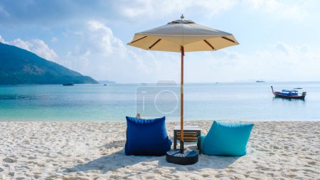 Photo for Beach chairs at the beach of Koh Kradan island in Thailand on a sunny day on the beach - Royalty Free Image
