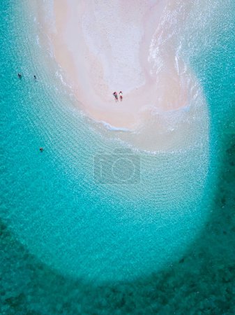 Photo for Couple of men and women on the beach of Ko Lipe Island Thailand. - Royalty Free Image
