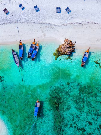 Photo for Drone view at the beach of Koh Lipe island in Thailand, longtail boats in the ocean of Ko Lipe - Royalty Free Image