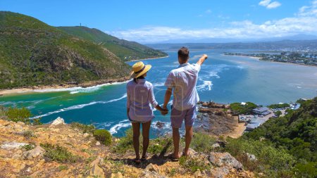 Photo for A panoramic view of the lagoon of Knysna, South Africa. beach in Knysna, Western Cape, South Africa. A couple of man and woman on a trip at the garden route in South Africa - Royalty Free Image