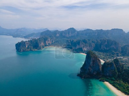 Photo for Droen aerial view at Railay Beach Krabi Thailand, the tropical beach of Railay Krabi, Panoramic view from a drone of idyllic Railay Beach in Thailand in the morning with a cloudy sky - Royalty Free Image