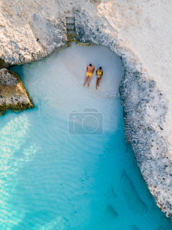 Photo for Tres Trapi Steps Triple Steps Beach, Aruba completely empty, Popular beach among locals and tourists for diving and snorkeling, couple man and woman in a crystal clear ocean in the Caribbean - Royalty Free Image