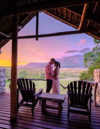 Photo for Mountains and grassland near Hermanus at the Garden Route Western Cape South Africa Whale coast. A couple man and woman mid age in front of their lodge during a vacation in South Africa - Royalty Free Image