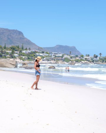 Photo for Women at the beach of Camps Bay Cape Town , Camps Bay beach, view during summer in Cape Town Sout Africa, - Royalty Free Image