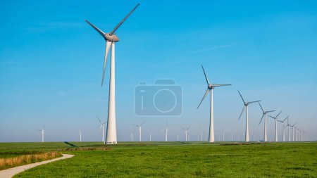 Photo for Windmill park in the ocean aerial view with wind turbine Flevoland Netherlands Ijsselmeer. Green Energy in the Netherlands - Royalty Free Image