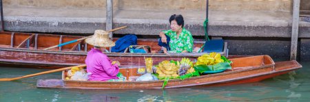 Photo for Bangkok Ratchaburi Thailand August 2023, market stall holders in small boats selling local fruits and vegetables, Damnoen Saduak Floating Market, Thailand - Royalty Free Image