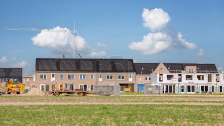 Photo for Newly build houses with solar panels attached on the roof , Solar panels on a gable roof. Beautiful, large modern house and solar energy. - Royalty Free Image