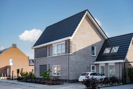 Photo for Dutch Suburban area with modern family houses, newly built modern family homes in the Netherlands, dutch family houses in the Netherlands, Modern Middle Class Real Estate on the Real Estate Market - Royalty Free Image