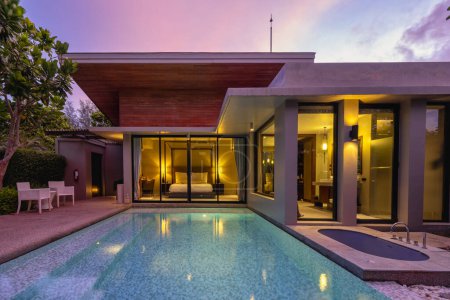 Photo for Modern house with a swimming pool, modern pool villa at the beach, luxury villa - Royalty Free Image