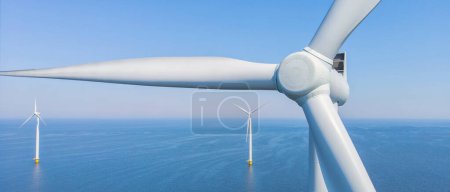 Photo for Windmill Park with a blue sky close up of windmill turbines at sea - Royalty Free Image