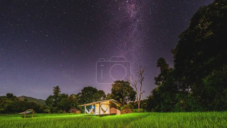 Photo for Terraced Rice Field in Chiangmai during the green rain season, Thailand. Royal Project Khun Pae Northern Thailand. milkyway starry night above a farm homestay - Royalty Free Image