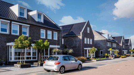 Photo for Dutch Suburban area with modern family houses, newly build modern family homes in the Netherlands, dutch family house in the Netherlands, newly build street with modern house - Royalty Free Image