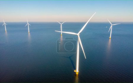 Photo for Clean new energy, Sustainable alternative energy, Offshore wind power plant, windmill energy in the Netherlands - Royalty Free Image