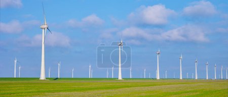Photo for Windmill park in the ocean, drone aerial view of windmill turbines generating green energy, windmills isolated at sea - Royalty Free Image