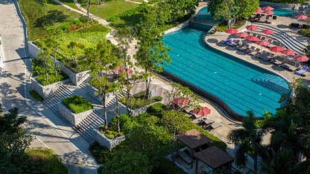 Photo for Drone view from above a swimming pool on a luxury vacation in Thailand, a pool of a luxury hotel in Thailand on vacation - Royalty Free Image