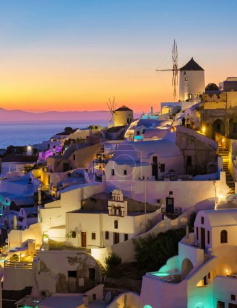 Photo for White churches an blue domes by the ocean of Oia Santorini Greece during sunset, a traditional Greek village in Santorini during summer at sunset blue hour - Royalty Free Image