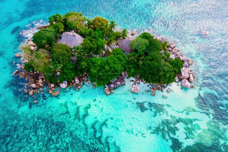 Photo for Drone view from above at a tropical Island in Seychelles. Anse Volbert beach Praslin with granite boulders rocks - Royalty Free Image
