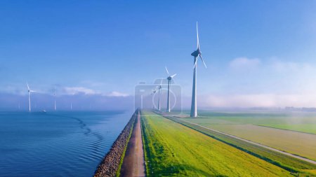 Photo for Windmill turbines Park with a blue sky, windmill turbines in the ocean - Royalty Free Image