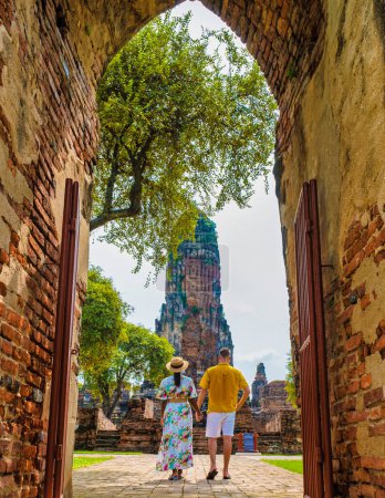 Photo for Ayutthaya Thailand at Wat Phra Ram, a couple of men and women with a hat visiting Ayutthaya Thailand., tourist walking at a temple ruin - Royalty Free Image