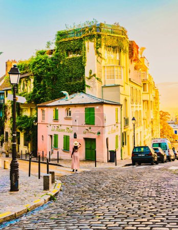 Photo for Paris France 12 September 2018, Streets of Montmartre in the early morning with cafes and restaurants, colorful street view at La Maison Rose France at sunrise - Royalty Free Image