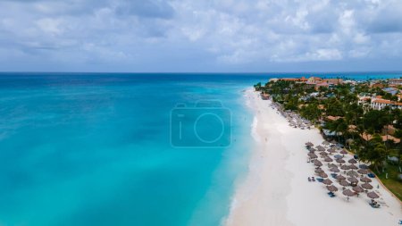 Photo for Eagle Beach Aruba with Palm Trees on the shoreline of Eagle Beach in Aruba, a aerial drone view at the beach on a sunny day - Royalty Free Image