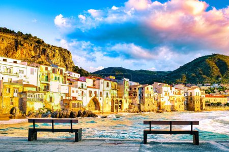 Photo for Sunset at the beach of Cefalu Sicily an old town of Cefalu Sicilia panoramic view of the colorful village Italy, two branch at waterfront of the coast in Sicily - Royalty Free Image