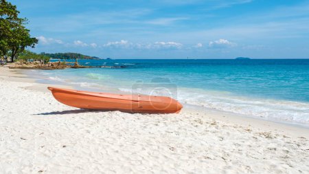 Photo for Koh Samet Island Rayong Thailand, a kayak on the white tropical beach of Samed Island with a turqouse colored ocean in the evening afternoon sun - Royalty Free Image