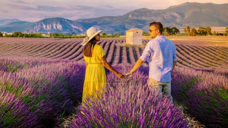 Photo for Provence, Lavender field France, Valensole Plateau, a colorful field of Lavender Valensole Plateau, Provence, Southern France.Couple of men and women on vacation in Southern France - Royalty Free Image