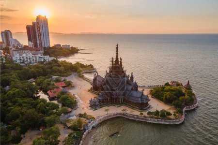 Photo for The Sanctuary of Truth wooden temple in Pattaya Thailand at sunset , drone aerial view at the wooden temple in Pattaya at dusk in the evening light - Royalty Free Image