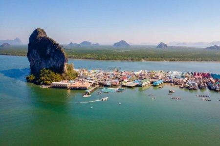 Panyee Island Phangnga Thailand with the floating wooden house on the water at the gypsy village in Phangnga Bay