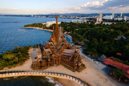 Photo for The Sanctuary of Truth wooden temple in Pattaya Thailand at sunset, drone aerial view at the wooden temple - Royalty Free Image