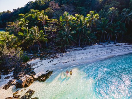 Photo for Drone aerial view at Koh Wai Island Trat Thailand is a tinny tropical Island near Koh Chang. a young couple of men and women on a tropical beach during vacation in Thailand - Royalty Free Image