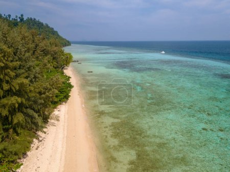 Photo for Drone aerial view at Koh Ngai island with palm trees and soft white sand, and a turqouse colored ocean in Koh Ngai Trang Thailand - Royalty Free Image