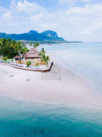 Photo for Drone aerial top view at Koh Muk a tropical island with palm trees and soft white sand, and a turqouse colored ocean in Koh Mook Trang Thailand - Royalty Free Image