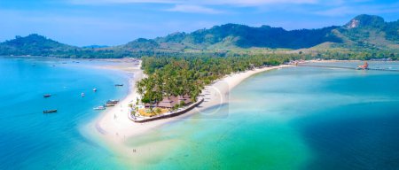 Drone top view at Koh Muk a tropical island in Trang Southern Thailand, a turqouse colored ocean in Koh Mook Trang Thailand with a white soft powdery sand beach