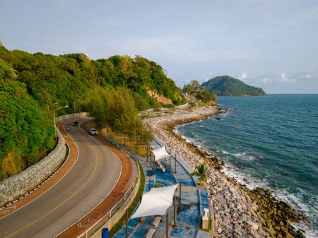 car driving on the curved road of Thailand. road landscape in summer. it's nice to drive on the beachside highway. Chantaburi Province Thailand, 
