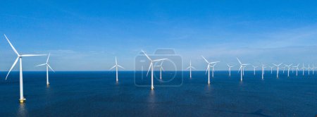 offshore windmill park and a blue sky, windmill park in the ocean. Netherlands Europe. windmill turbines in the Noordoostpolder Flevoland